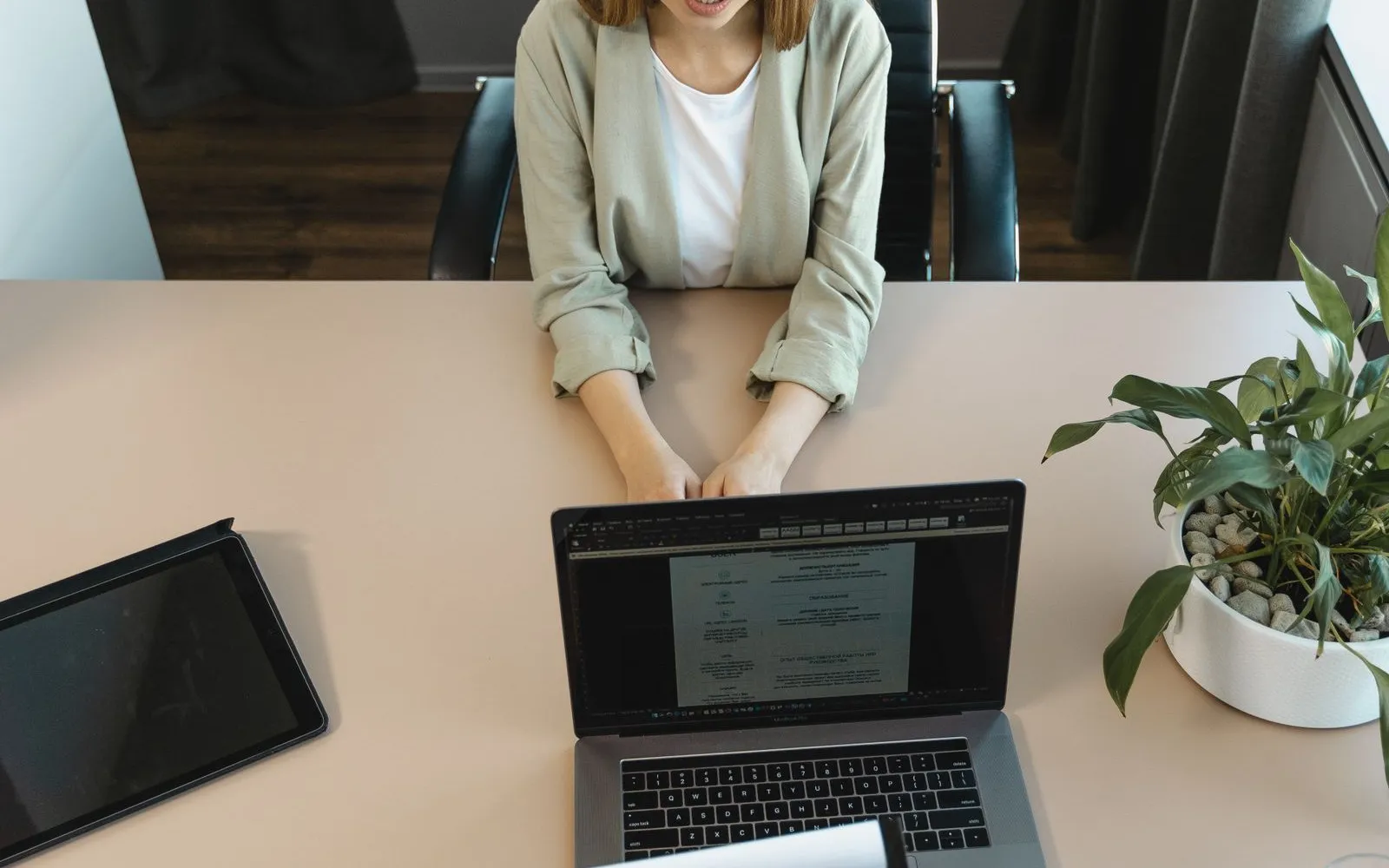 A job interview across a desk — the outcome most ghost job applications never reach