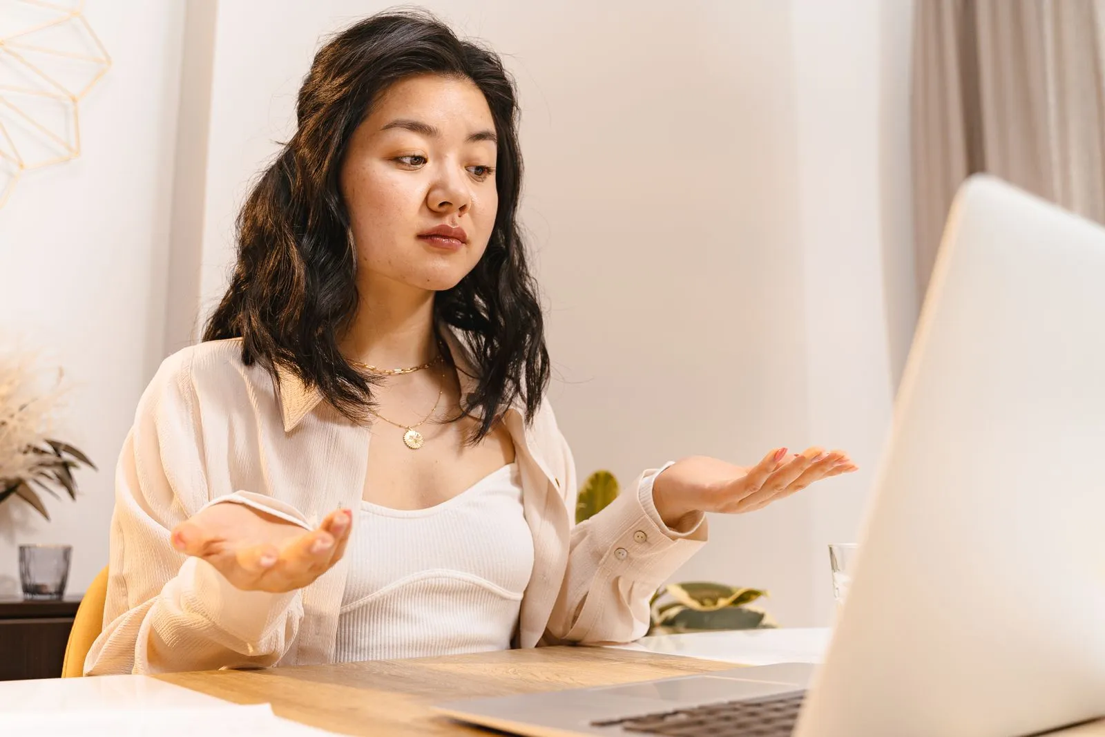 Puzzled job seeker at a laptop — most hidden job market advice creates more confusion than clarity